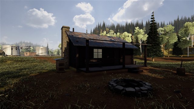 A cabin in the woods with a fire pit