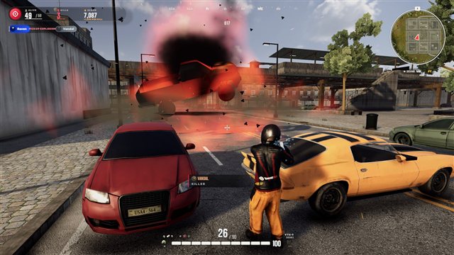 A burning pickup explodes and flips in a city street